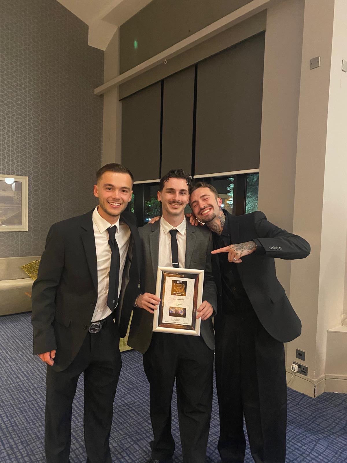 The ILL Fate team holding their framed award